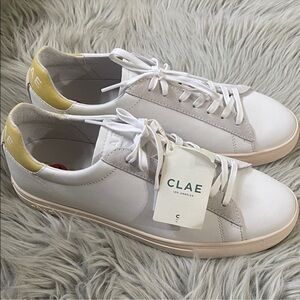 Clae White Sneakers with Yellow Heel Accent